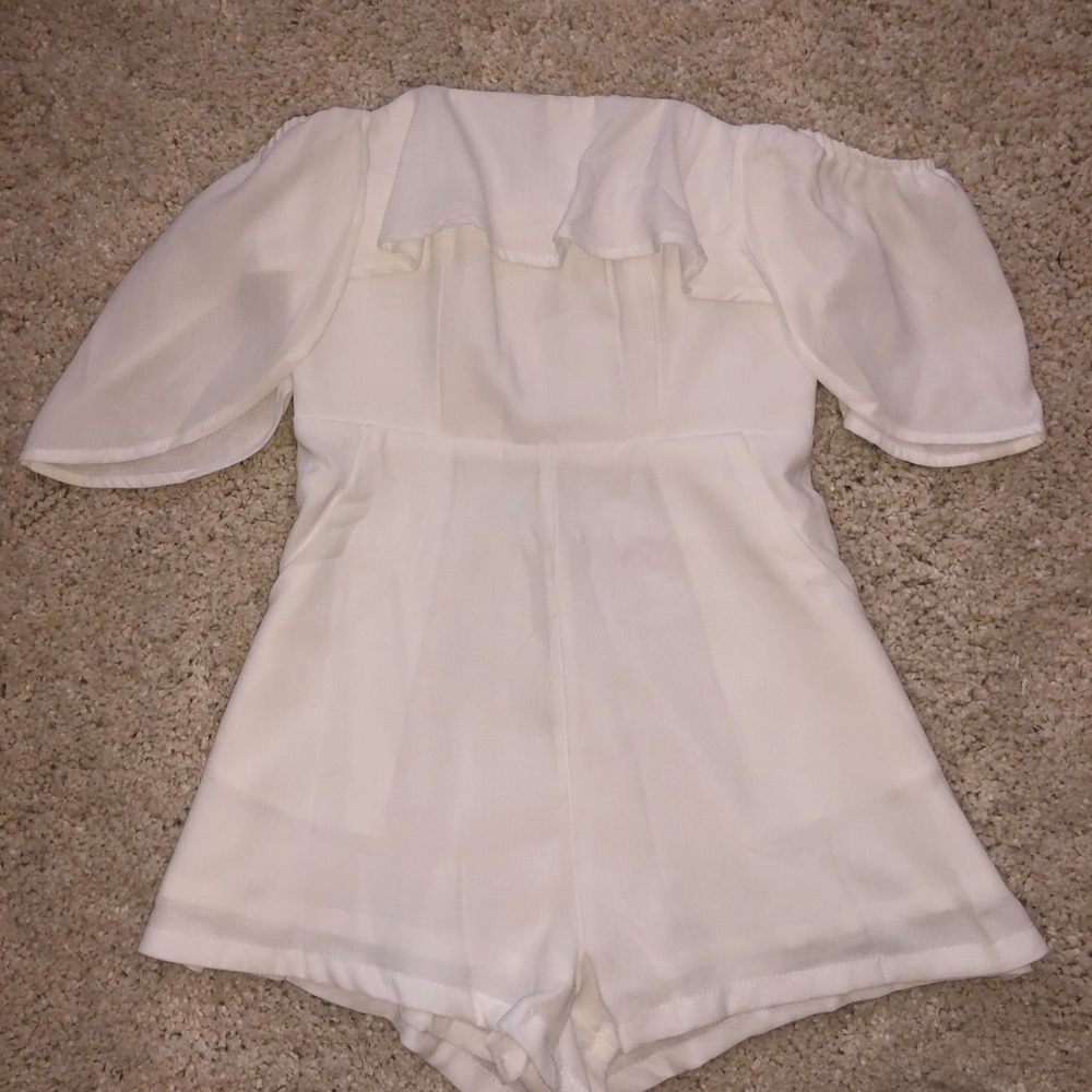 Brand new white play suit from Polly